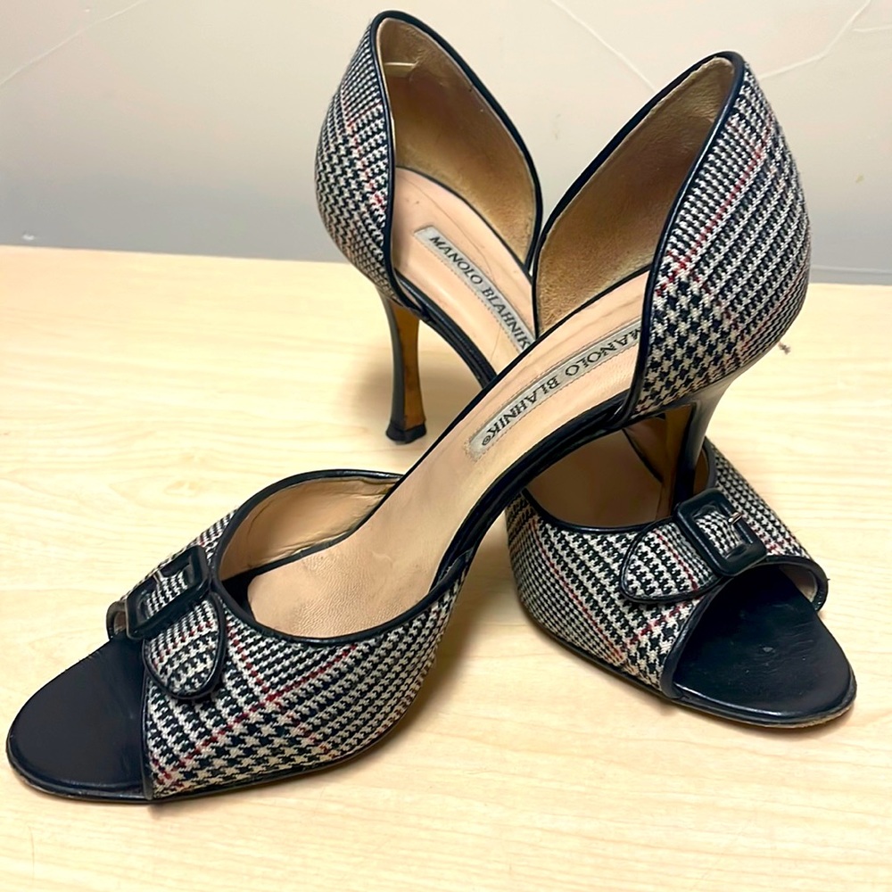Authentic, Manolo Blahnik open toed pumps purchased at Saks Fifth Avenue.
